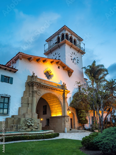 Illuminated Superior Court Of California County Of Santa Barbara, USA in the evening against blue sky