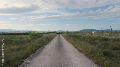 Peaceful Drive Through Sunny Natural Landscape
