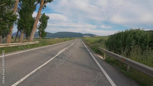 Peaceful Drive Through Sunny Natural Landscape