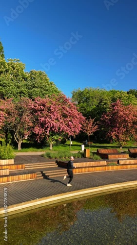 Man Running in Warsaw Park by the Lake – Drone Vertical Morning Shot