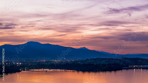 Sunset Over Hobart, Tasmania – Evening Cityscape with Mountains and Water Reflections