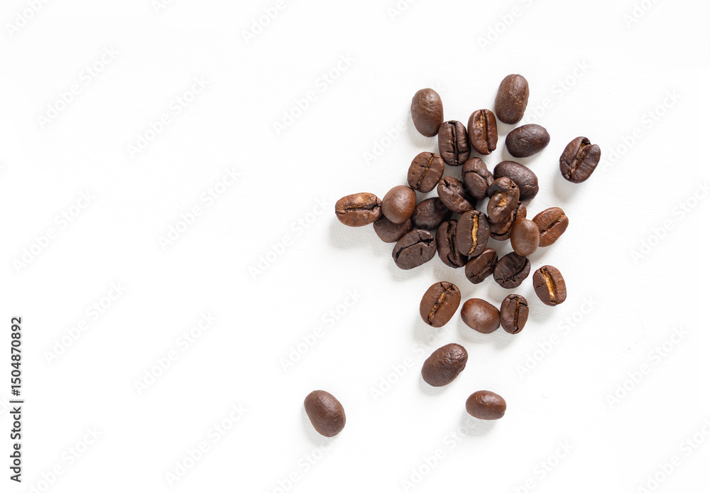 Brown roasted coffee beans seeds. Isolated of coffee bean on white background. Close up image. Brown roasted coffee beans seeds. Isolated of coffee bean on white background. Close up image.