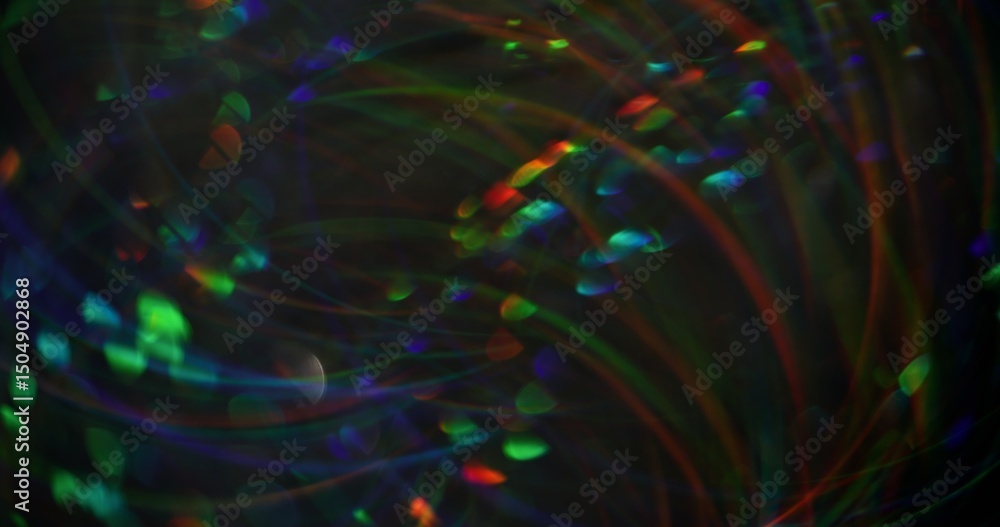 Obraz premium Blurred glare light. Art color. Majestic green orange blue kaleidoscope lens flare swirling on modern bokeh abstract background.