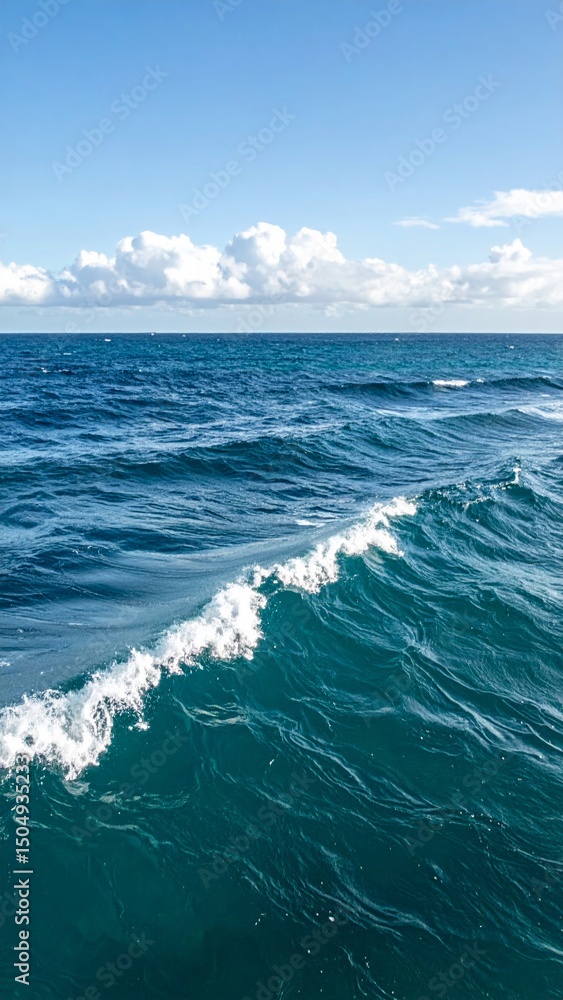Fototapeta premium Calm ocean waves under a clear sky or light clouds 