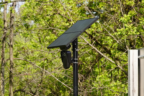 Flock safety police law enforcement license plate reader set up outside to help catch vehicle speeders.