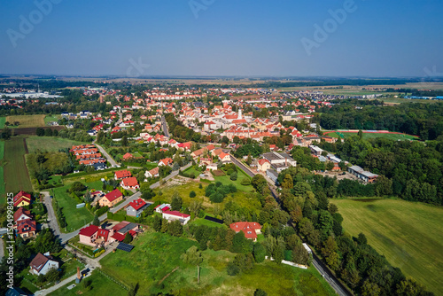Fototapeta Naklejka Na Ścianę i Meble -  Aerial view of European small town. Drone view of urban landscape with residential building, green parks and city streets