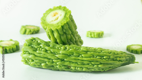 Fotografi Karela thrives in tropical climates and grows as a vine with distinctively bumpy fruits