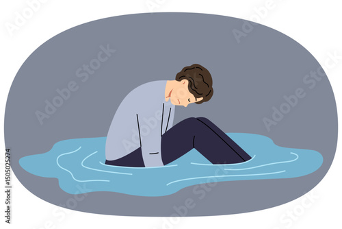 Depressed man sits in puddle of tears, feeling apathy after breaking up with girlfriend or being fired from job. States of apathy in guy in need of friendly support or help from psychologist