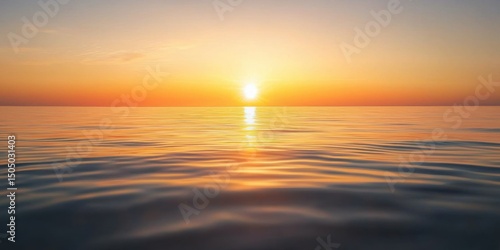 Fototapeta Naklejka Na Ścianę i Meble -  A sunrise over a still, glassy sea with no land in sight