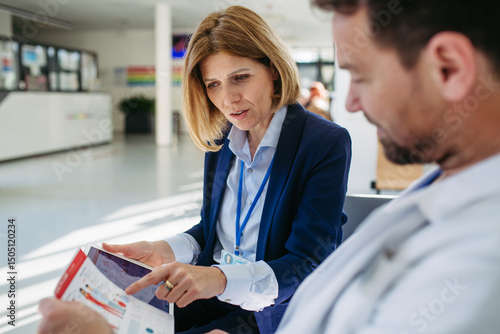 Wall Mural Pharmaceutical rep and doctor discussing drug samples and prescriptions