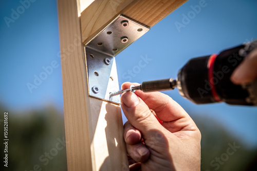 metal bracket attached to a wooden post with a screw