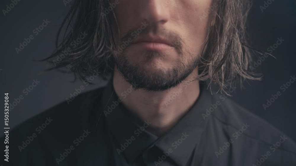 Somber Reflection: Close-Up of Intense Man with Long, Wet Hair in Dark Room Contemplating Life's Depths Somber Reflection: Close-Up of Intense Man with Long, Wet Hair in Dark Room Contemplating Life's Depths