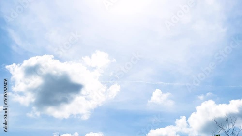 Abstract Heaven, White Clouds And Sunlight Glowing On Cloudy Light Blue Sky Background With Branches Of Tree Compound Of A Sylvan Monastery At Bangkok, Thailand. 06 APR 2025 A.M./ Speed Up VDO