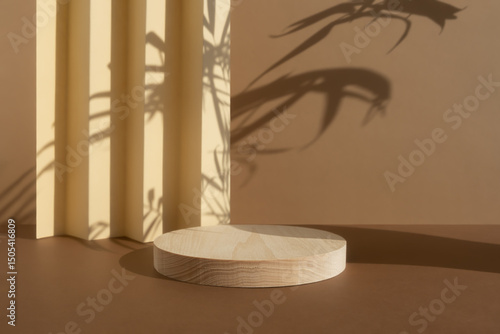 Geometric wooden podium on an abstract beige and brown background with a shade of palm leaves. A scene with a geometric background. Backdrop for the product presentation. Showcase, display case.