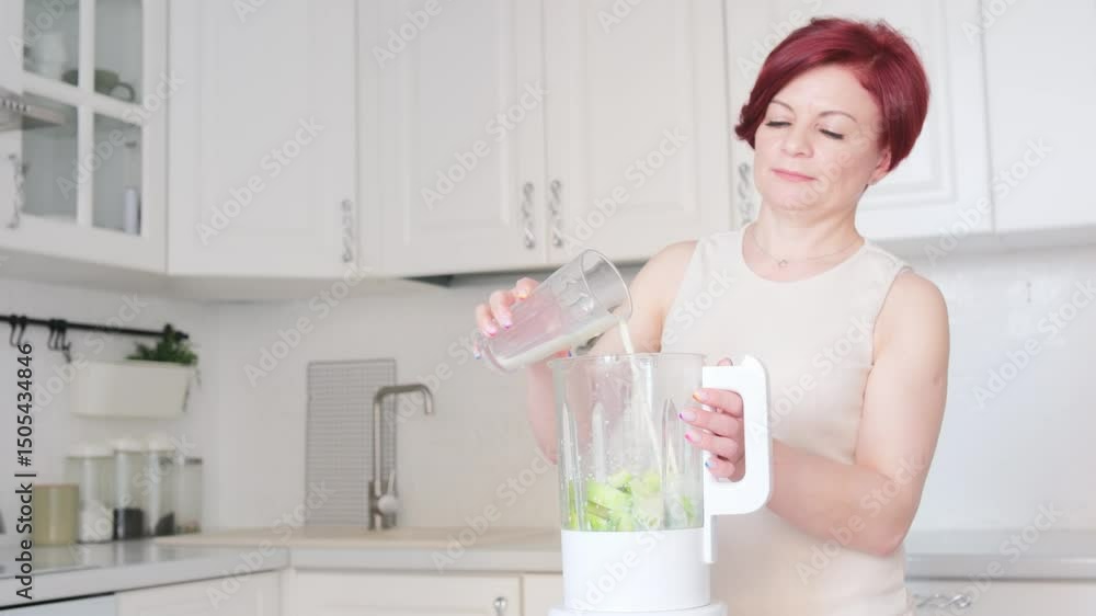A woman makes a vibrant healthy smoothie with fresh fruits and greens,pouring milk in blender, promoting a healthy lifestyle enthusiastically A woman makes a vibrant healthy smoothie with fresh fruits and greens,pouring milk in blender, promoting a healthy lifestyle enthusiastically