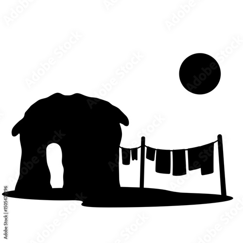 Silhouette of mud house and laundry line – traditional rural sustainable living