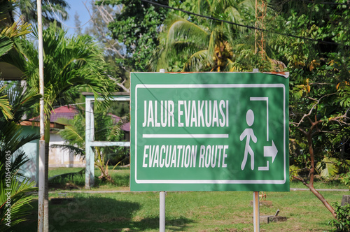 evacuation route information board on the beach