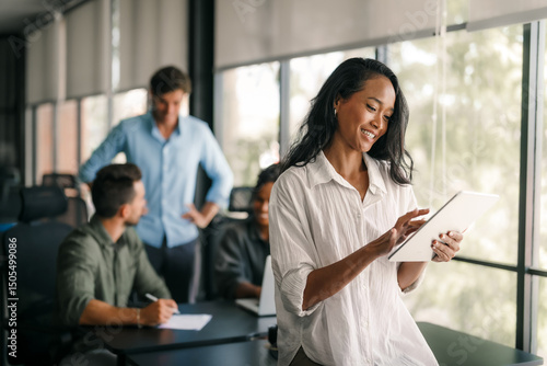 Group of busy happy diverse professional business team people working in office using digital tablet
