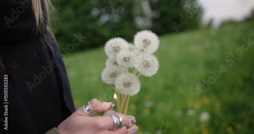 Young Woman Burning Dandelions in Hand – 4K Mid Shot Conceptual Lifestyle with Dramatic Flames