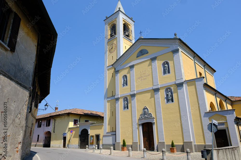 Obraz premium Old buildings at Corneliano Bertario, historic village in Milan province, Italy: San Giorgio church