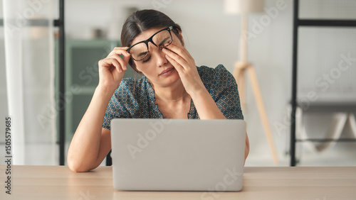Canvastavla Young woman suffers from eye pain and rubs her eye