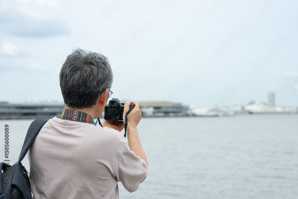 Obraz premium カメラを構える男性