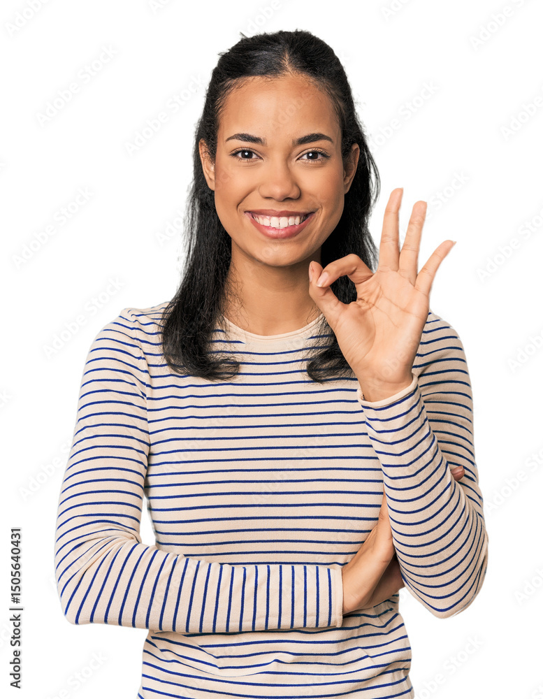 Young Filipina woman winks an eye and holds an okay gesture with hand. Young Filipina woman winks an eye and holds an okay gesture with hand.