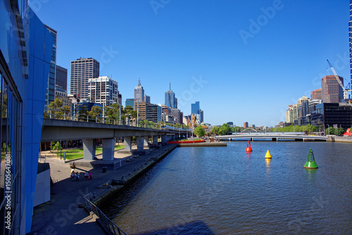 Melbourne Yarra river with oncoming train overlooking city