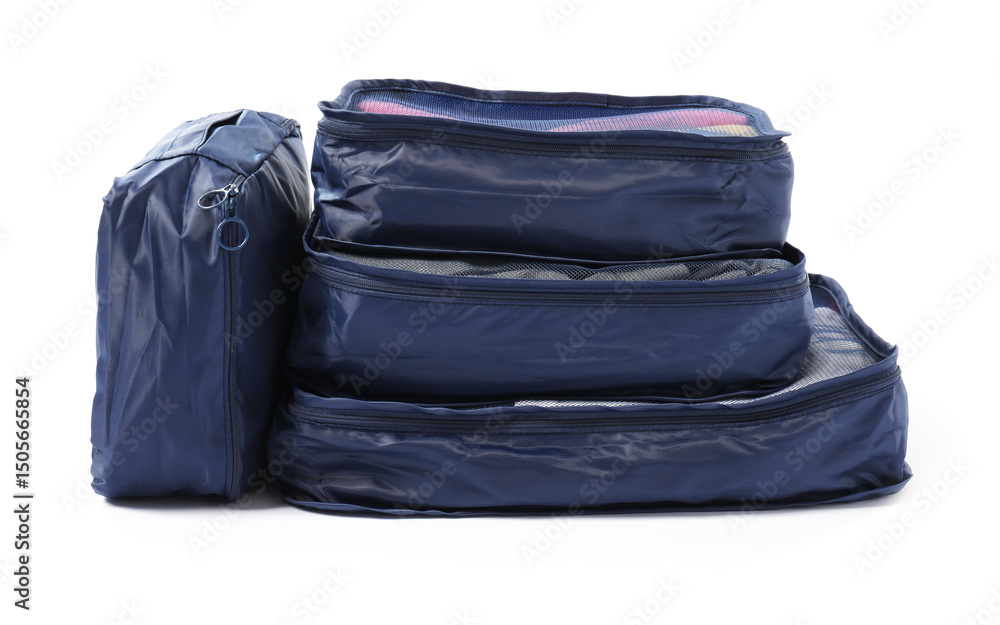 Fototapeta premium Blue packing cubes isolated on white. Storage organizer