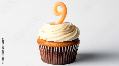 Birthday cupcake with lit birthday candle Number nine on white background