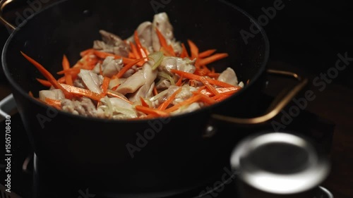 Frying Chicken and Carrots for Pilaf Preparation.