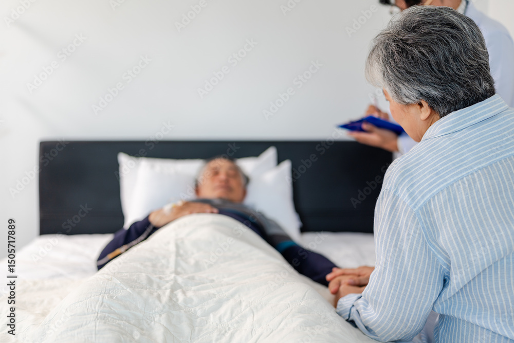scene of bedridden patient, back view of wife illness's relative holding hand elderly hopeless senior male with infectious disease, concept of nursing home care or medical treatment in hospital ward scene of bedridden patient, back view of wife illness's relative holding hand elderly hopeless senior male with infectious disease, concept of nursing home care or medical treatment in hospital ward