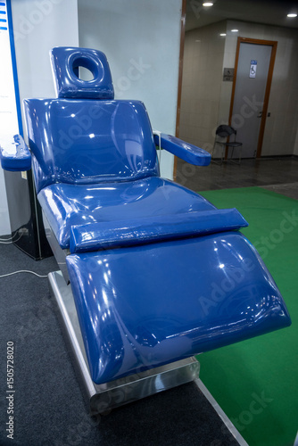 The blue glazed dental chair is designed for patient comfort during dental procedures, enhancing patient experience.
