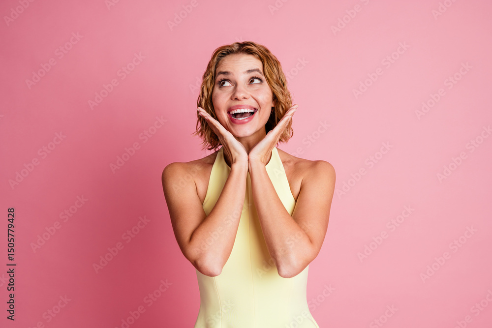 Smiling young woman posing joyfully against a pink background, wearing a yellow dress, showcasing cheerful and stylish vibes Smiling young woman posing joyfully against a pink background, wearing a yellow dress, showcasing cheerful and stylish vibes