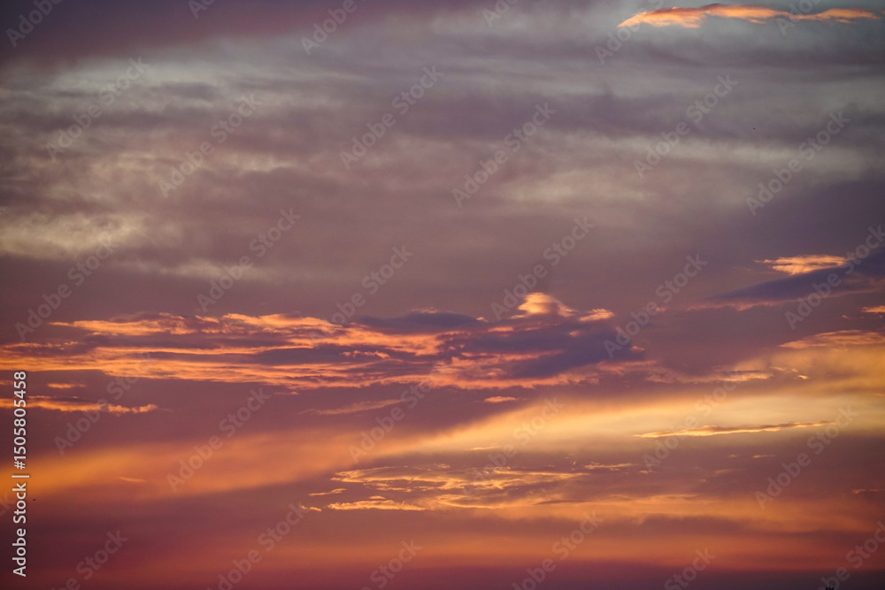Fototapeta premium Colorful sky background. sunset with orange dramatic sky at dawn. Natural Bright Orange Dramatic Sky In Sunset Dawn Sunrise. Amazing Bold Golden Sunset Sunrise Sky Background.
