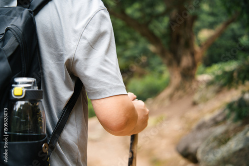 asian man hiking in mountain