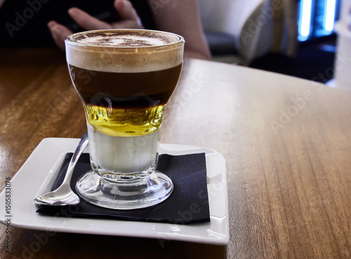 Asian coffee. This is a typical coffee from Cartagena (Spain). It is made with liqueur, lemon zest, cinnamon, condensed milk, coffee beans, and coffee. Brandy is sometimes added.
