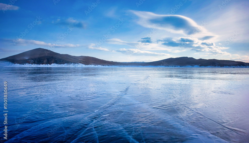 Fototapeta premium Landscape of Mountain at sunset with natural breaking ice in frozen water on Lake Baikal, Siberia, Russia.