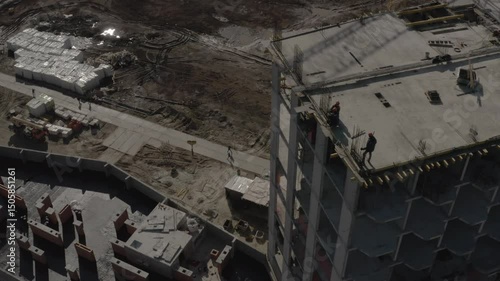 Tobolsk, drones, aerial photography, aerial view, a row of multi-storey residential buildings on the outskirts of the city, crane, builders, work, containers, monolith, concrete, reinforcement.