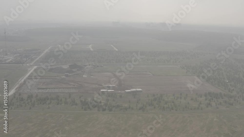 Tobolsk, drone, aerial photography, quadcopter, planting of young fir trees, outskirts of the city, city view, multi-storey new buildings, private houses, quarry, fields, forest belt, building