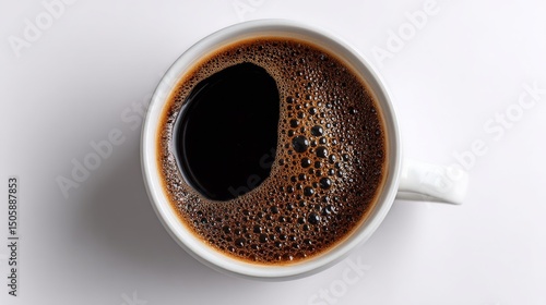 Coffee Brews With Rich Bubbles in a White Cup Against a Simple Background.