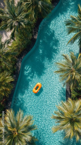 Relaxing View of a Pool Surrounded by Palm Trees With a Bright Orange Float i...