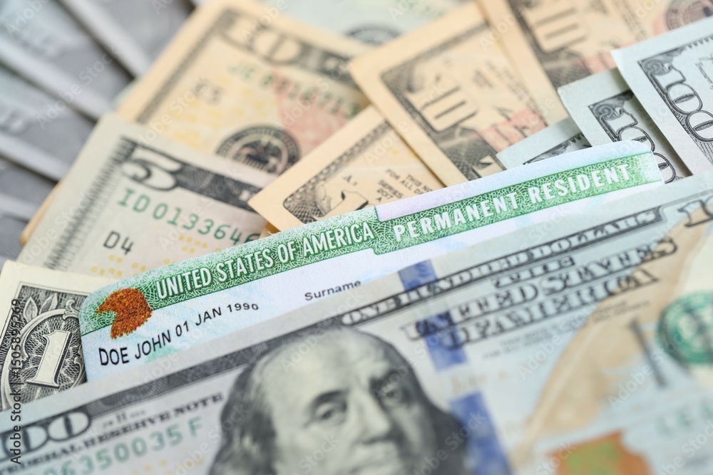 American US dollars money bills and green card close up. Immigration and naturalization American US dollars money bills and green card close up. Immigration and naturalization