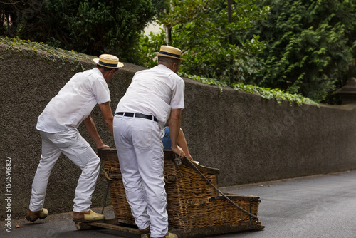 The (Carreiros) runners with wicker basket car. The Monte Sledges. Madeira island, Portugal