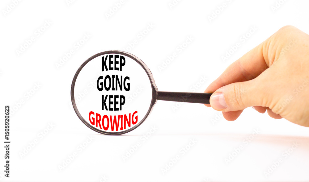 Keep going and growing symbol. Concept words phrase Keep going keep growing in beautiful black magnifying glass. Beautiful white background. Business Keep going and growing concept. Copy space. Keep going and growing symbol. Concept words phrase Keep going keep growing in beautiful black magnifying glass. Beautiful white background. Business Keep going and growing concept. Copy space.