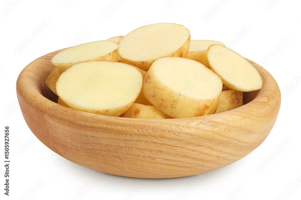 young potato slices in a wooden bowl isolated on white background. Harvest new young potato slices in a wooden bowl isolated on white background. Harvest new