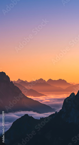 Sunrise over misty mountain ranges