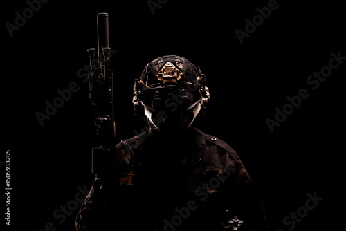 Konstfotografi Silhouette of a Tactical Soldier with Equipment in a Dark Background