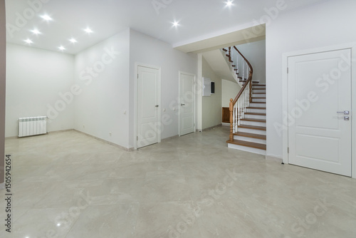 Wallpaper Mural The hall of a country house with white decor of walls and ceiling, beige floor tiles. Stairs with wooden steps to the second floor. Torontodigital.ca