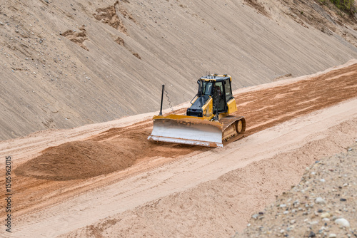 Bulldozer Leveling Sand at Construction Site – Heavy Equipment Grading Ground in Open Pit Quarry